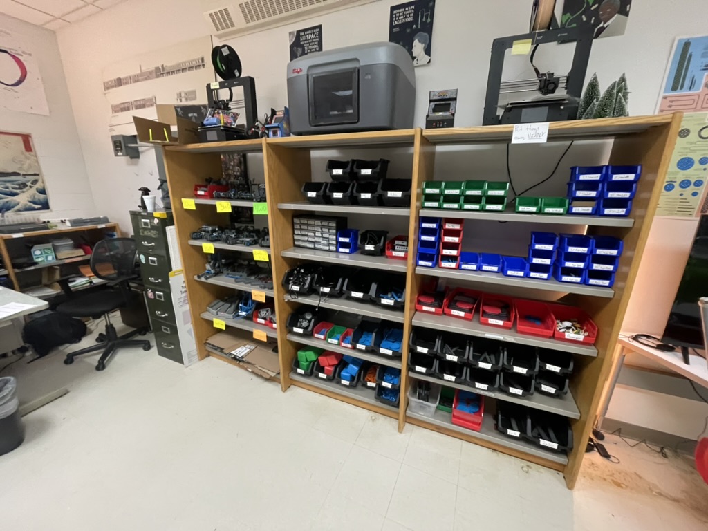 Storage shelves of parts and 3D printers in the lab